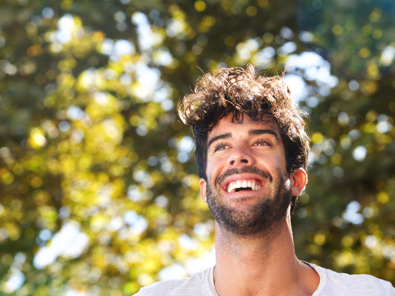 man putting in invisalign clear aligners