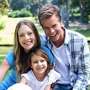 family smiling for the camera
